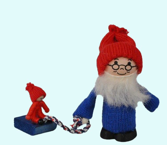 Tomte w/ child on sled