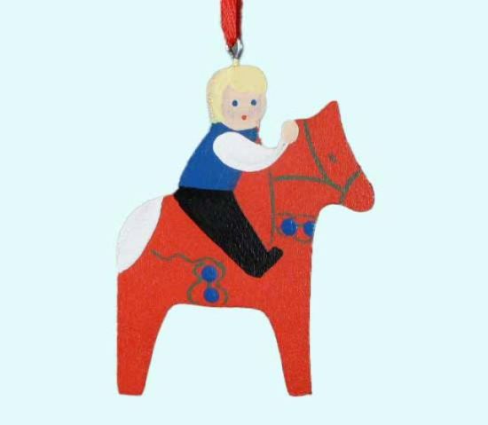 Swedish boy on red Dalahorse