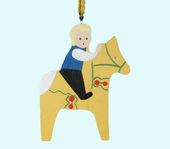 Swedish boy on yellow Dalahorse