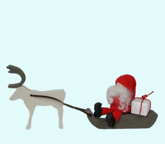 Tomte on sled w/ reindeer