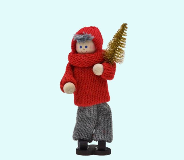 Tomte boy carrying gold tree